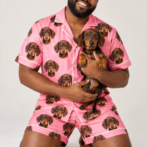 Man in mens pajamas holding his dachshund — MyDogPics