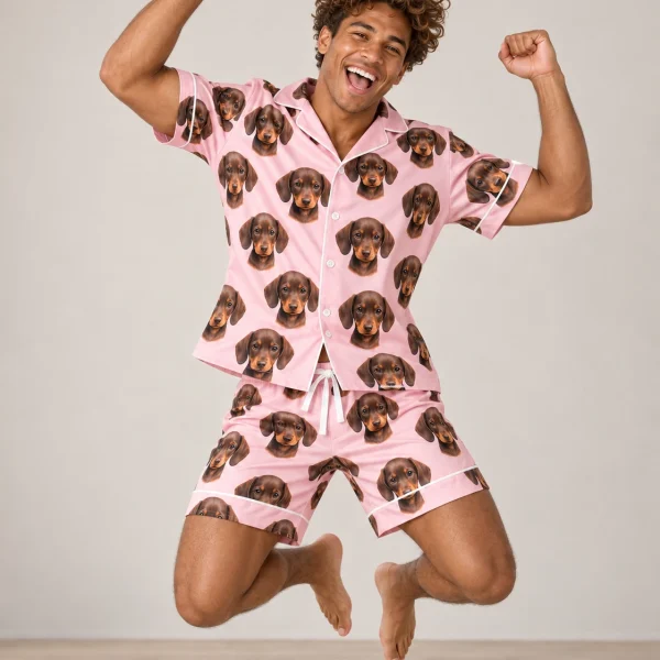 Man posing in mens pajamas, brown dachshund puppy faces on blush pink satin — MyDogPics