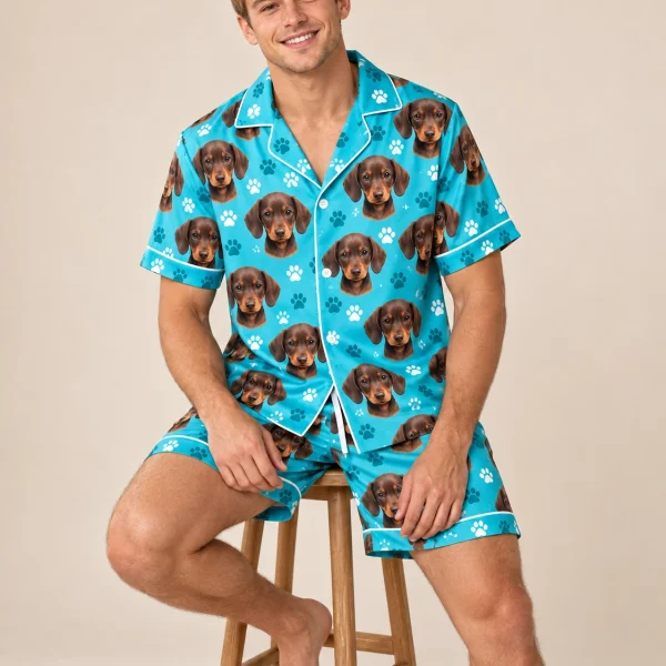 Man sitting in mens pajamas covered in brown dachshund puppy faces — MyDogPics