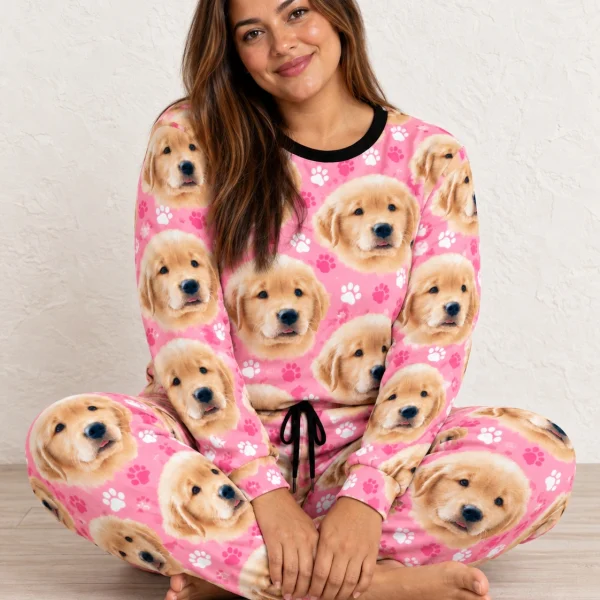 Woman sitting in a pajama sets for women covered in golden retriever puppy faces — MyDogPics