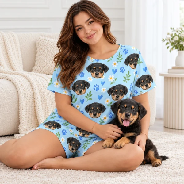 Woman in a pajama short set cuddling her Rottweiler puppy — MyDogPics