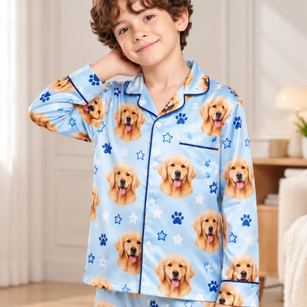 Close-up of the personalized pajamas for kids print: golden retriever faces on sky blue satin with stars — MyDogPics