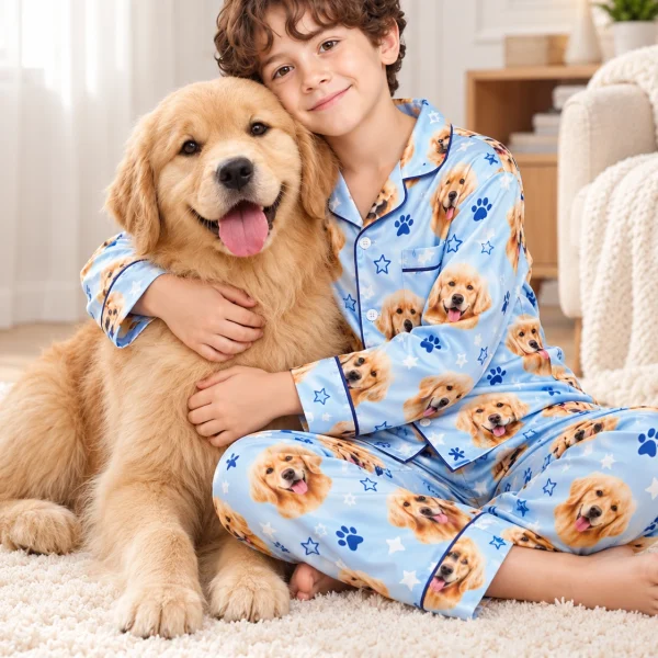 Boy in a personalized pajamas for kids cuddling his golden retriever — MyDogPics