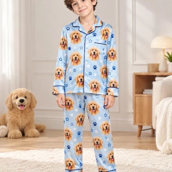 Boy wearing a personalized pajamas for kids covered in golden retriever faces on sky blue satin with stars — MyDogPics