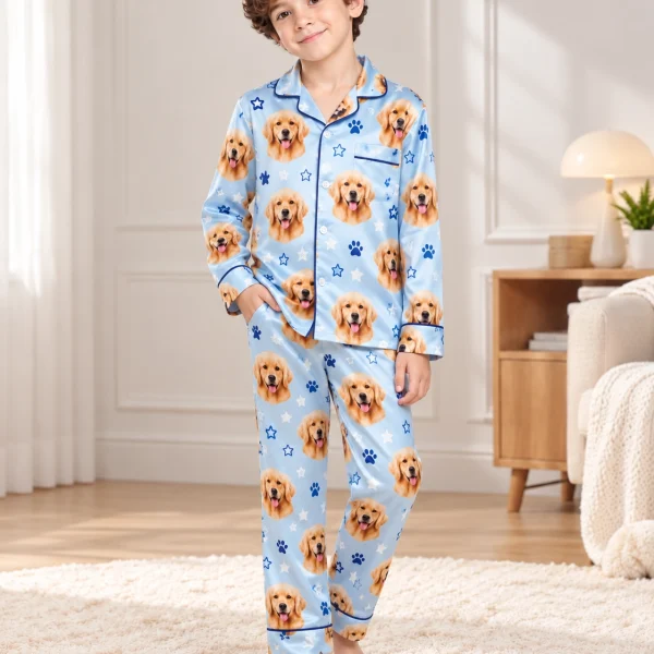 Boy posing in a personalized pajamas for kids, golden retriever faces on sky blue satin with stars — MyDogPics