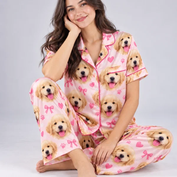 Woman sitting in personalized satin pajamas covered in golden retriever puppy faces — MyDogPics