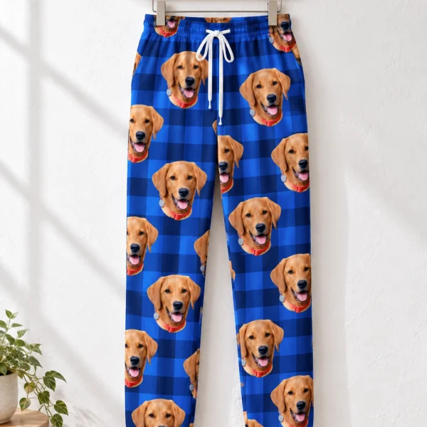 Pink pajama pants pants hanging up, covered in golden retriever faces — MyDogPics