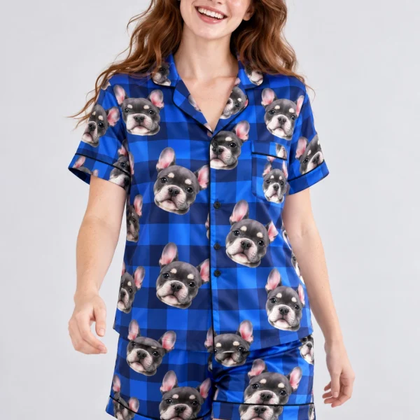 Woman wearing a pink pajama set covered in grey French bulldog faces on blue plaid satin — MyDogPics