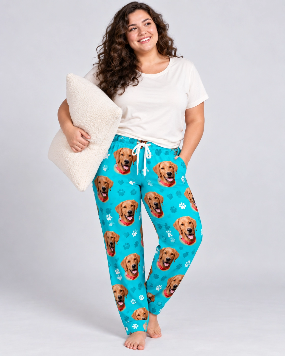 Plaid Pajama Pants – Front View, Teal Paw-Print | MyDogPics Woman wearing plaid pajama pants covered in golden retriever faces on teal paw-print fabric — MyDogPics