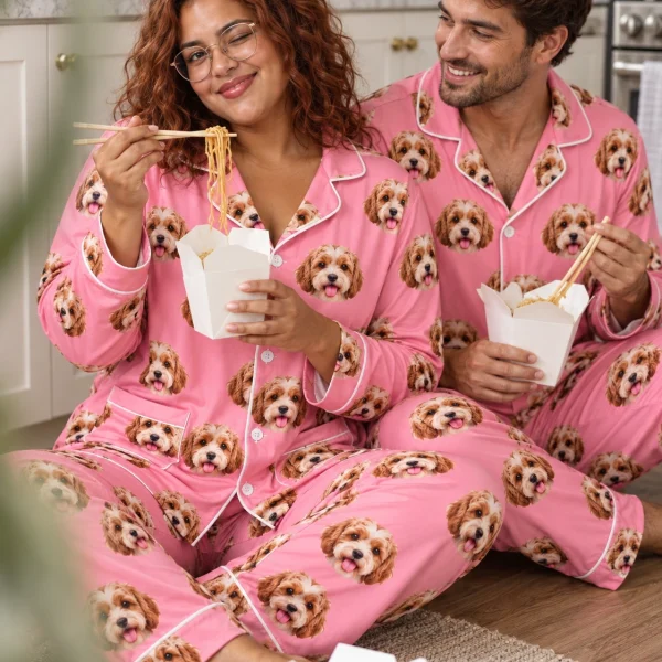 Woman and her partner in matching plaid pajamas with doodle puppy faces on pink fabric with contrast piping — MyDogPics