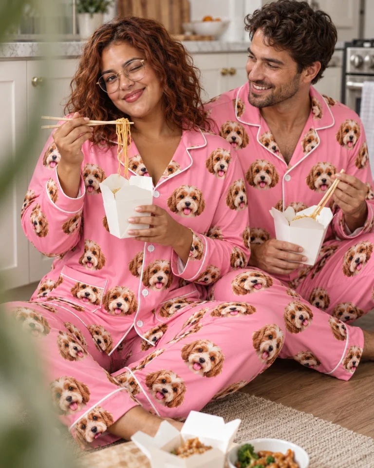 Woman and her partner in matching plaid pajamas with doodle puppy faces on pink fabric with contrast piping — MyDogPics