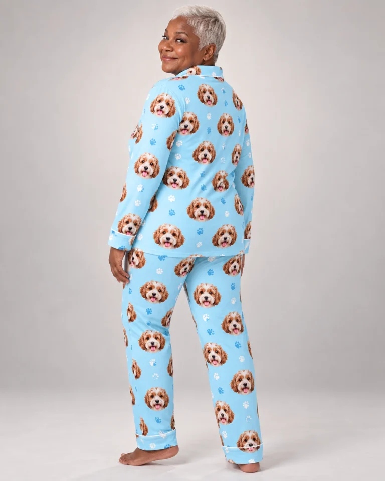Woman posing in plaid pajamas, doodle puppy faces on light blue paw-print fabric with contrast piping — MyDogPics