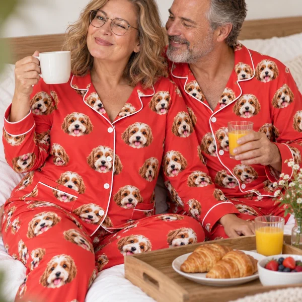 Woman and her partner in matching plus size pajamas with doodle puppy faces on red fabric with contrast piping — MyDogPics