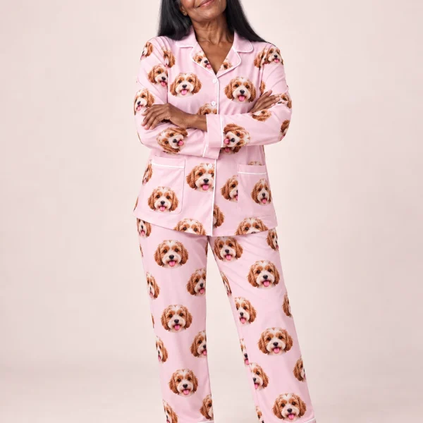 Woman wearing plus size pajamas covered in doodle puppy faces on blush pink fabric with contrast piping — MyDogPics