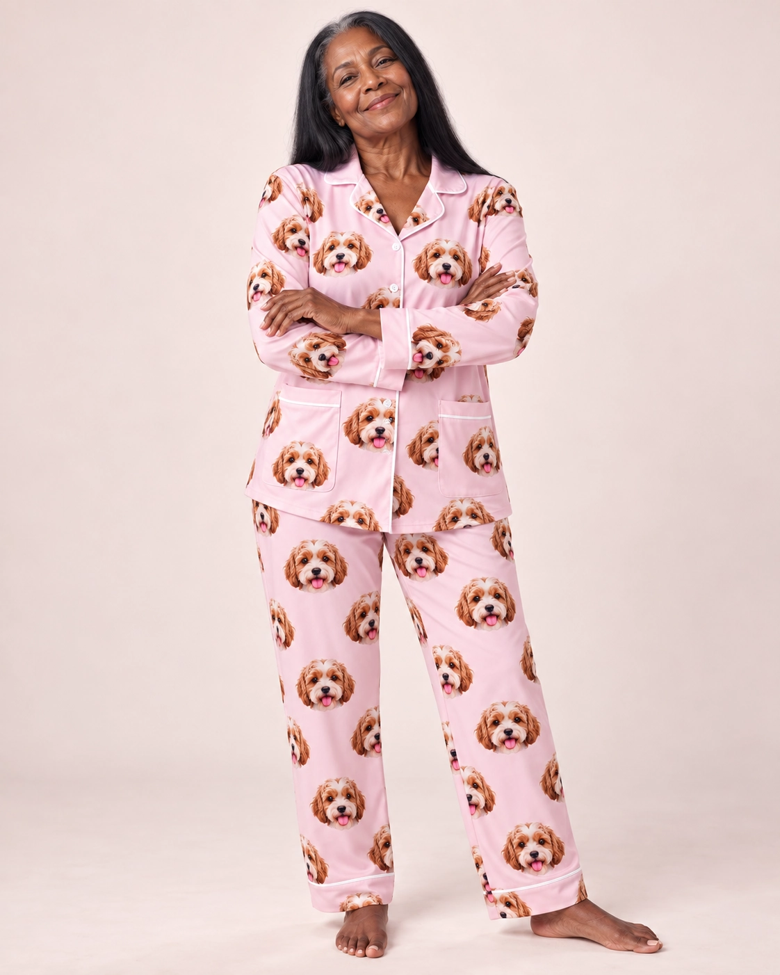 Plus Size Pajamas – Front View, Blush Pink | MyDogPics Woman wearing plus size pajamas covered in doodle puppy faces on blush pink fabric with contrast piping — MyDogPics