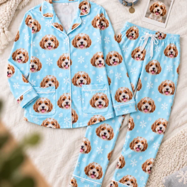 Flat lay of red pajamas: shirt and pants covered in doodle puppy faces — MyDogPics