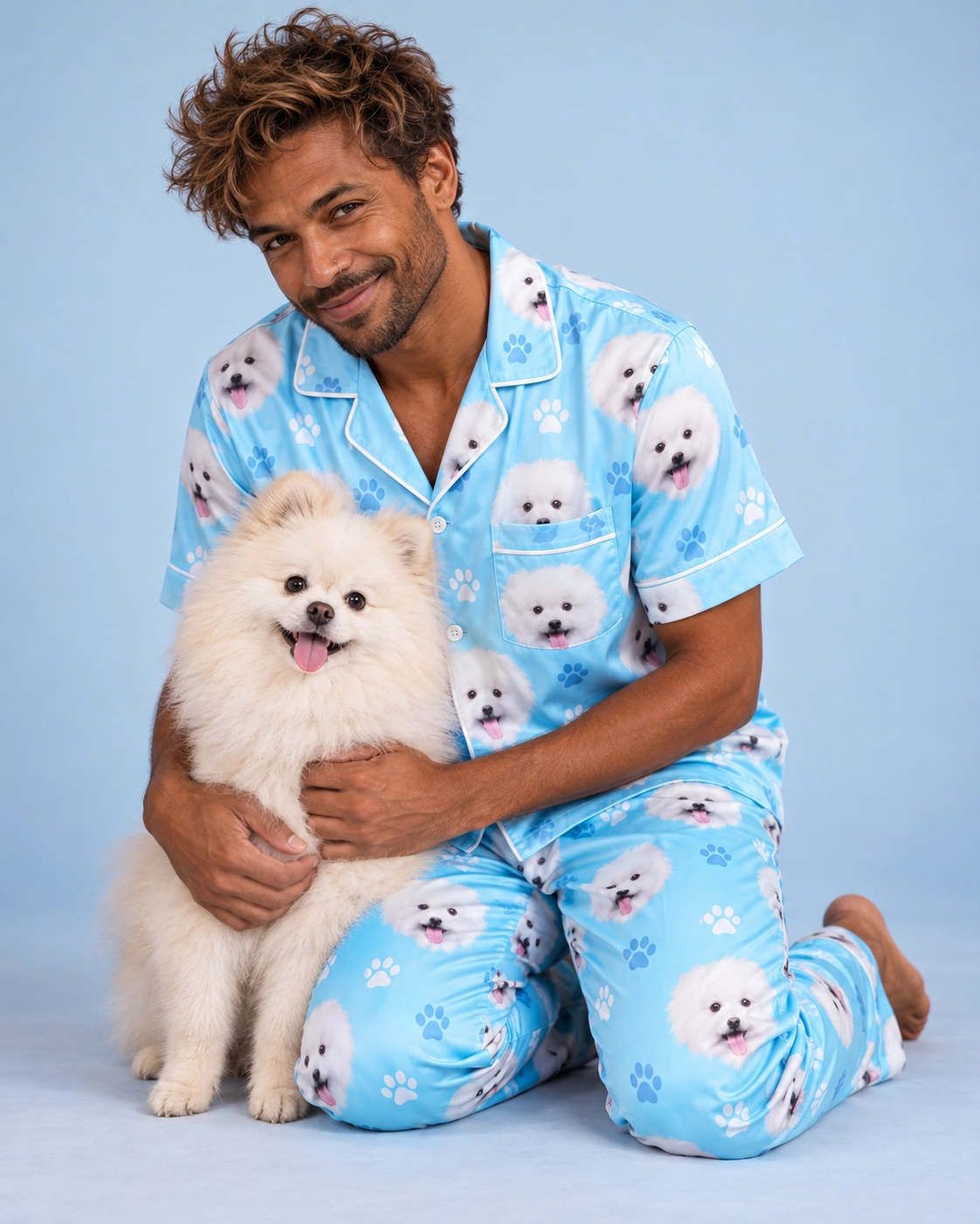 Red Satin Pajamas – Cuddling Dog, Light Blue Paw-Print | MyDogPics Man in red satin pajamas cuddling his Pomeranian — MyDogPics