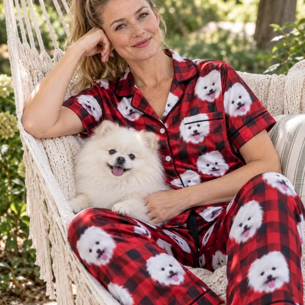 Woman in red satin pajamas with her Pomeranian — MyDogPics
