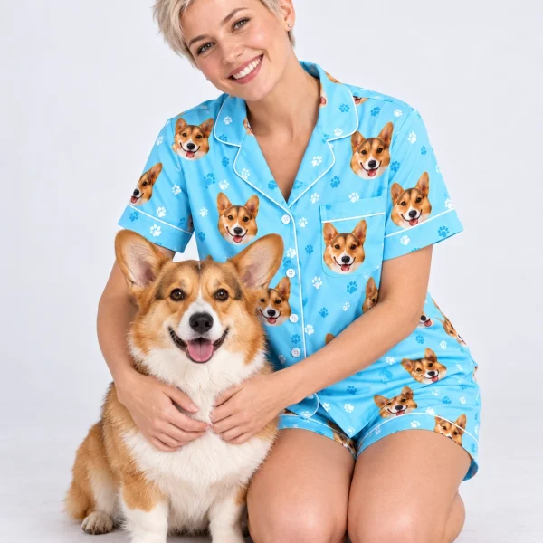Woman in a satin pajamas for women cuddling her corgi — MyDogPics