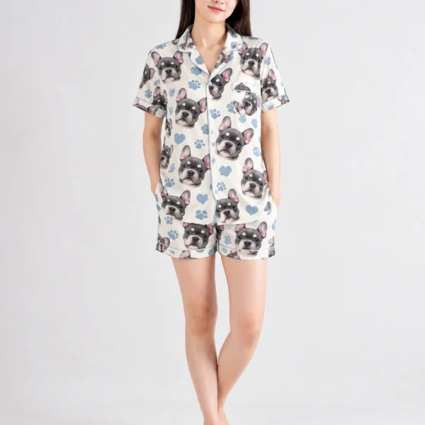 Woman wearing a satin short pajama set covered in grey French bulldog faces on cream satin with blue hearts — MyDogPics