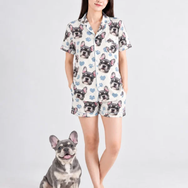 Woman in a satin short pajama set standing next to her French bulldog — MyDogPics
