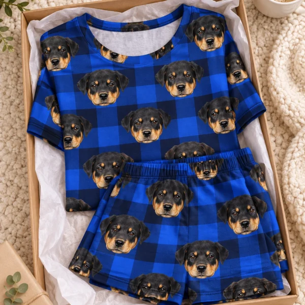 Flat lay of short sleeve pajamas: shirt and shorts covered in Rottweiler puppy faces — MyDogPics