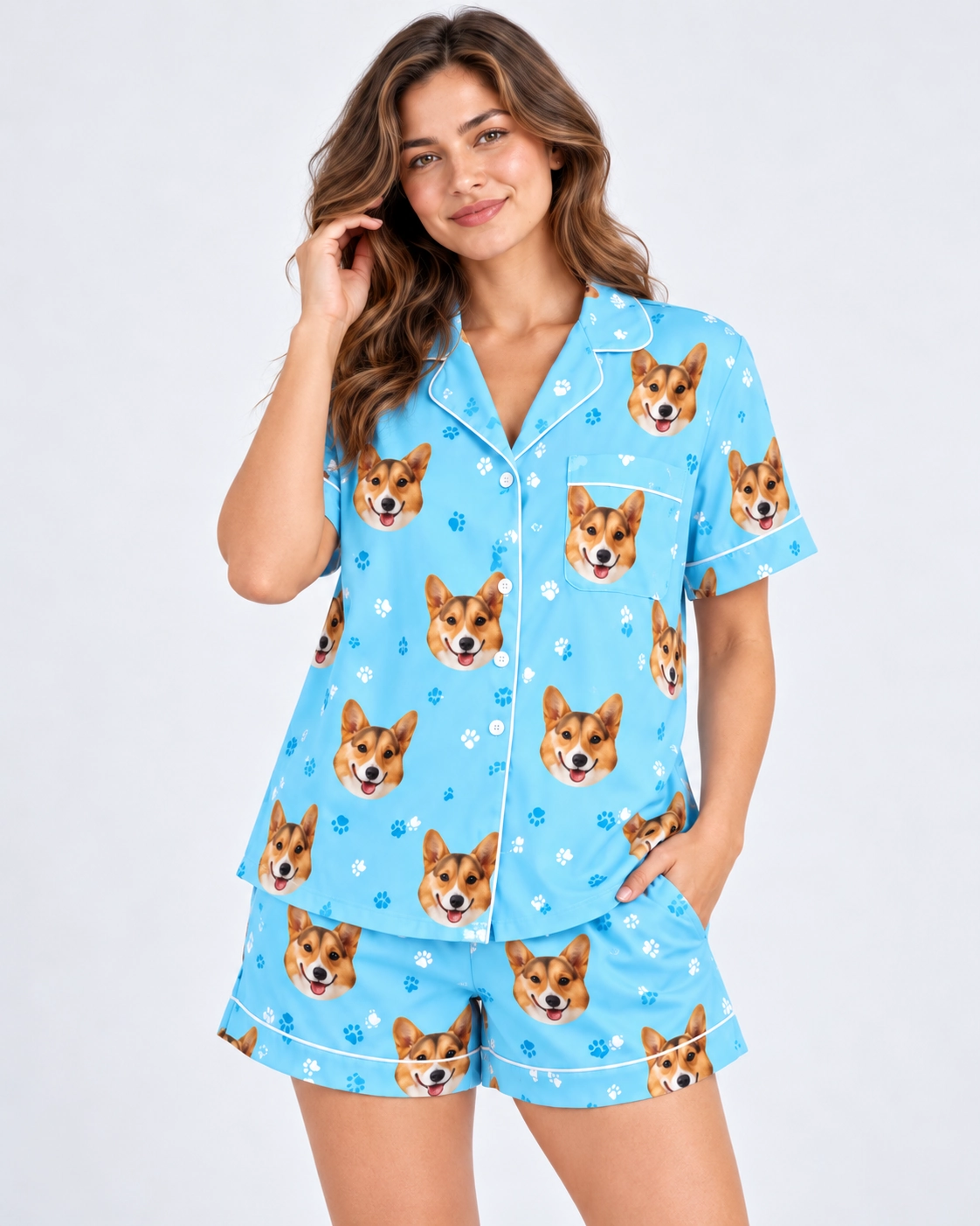 Short Sleeve Satin Pajama Set – Print Close-Up | MyDogPics Close-up of the short sleeve satin pajama set print: corgi faces on sky blue satin with white piping — MyDogPics