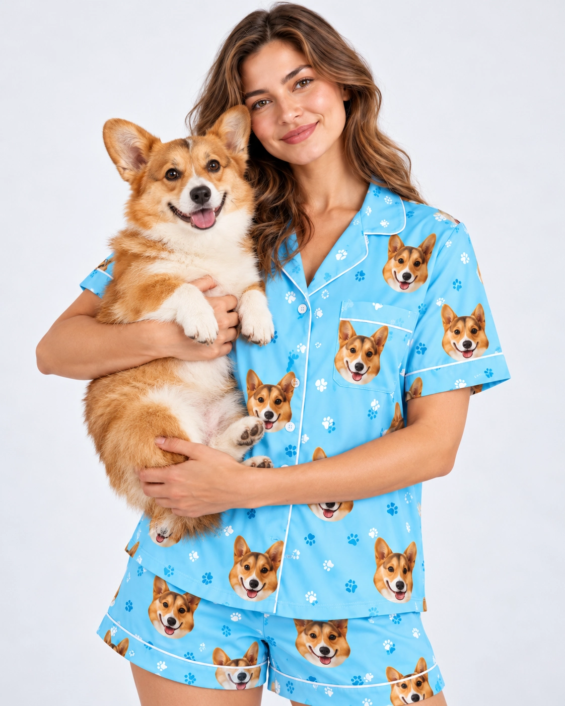 Short Sleeve Satin Pajama Set – Holding Dog | MyDogPics Woman in a short sleeve satin pajama set holding her corgi — MyDogPics