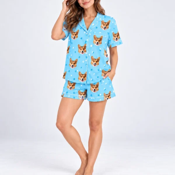 Woman posing in a short sleeve satin pajama set, corgi faces on sky blue satin with white piping — MyDogPics