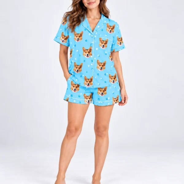 Woman posing in a short sleeve satin pajama set, corgi faces on sky blue satin with white piping — MyDogPics
