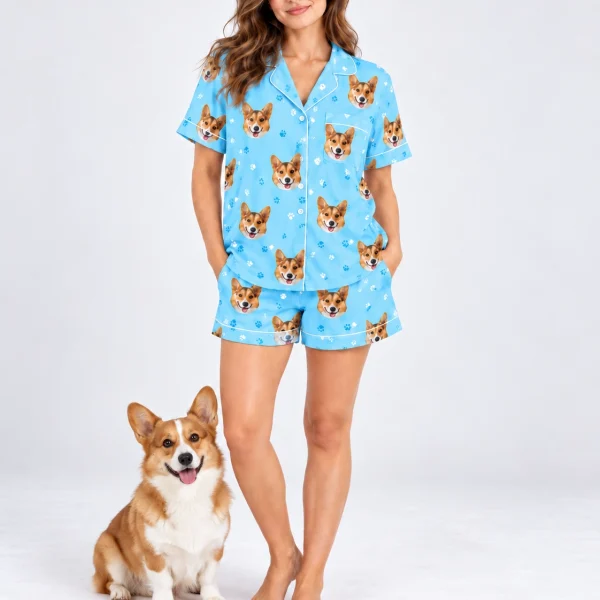 Woman in a short sleeve satin pajama set standing next to her corgi — MyDogPics