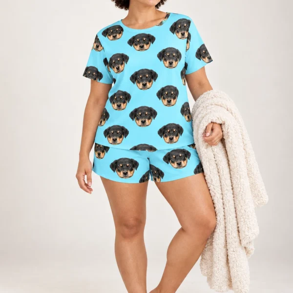 Woman wearing summer PJs covered in Rottweiler puppy faces on light blue fabric — MyDogPics