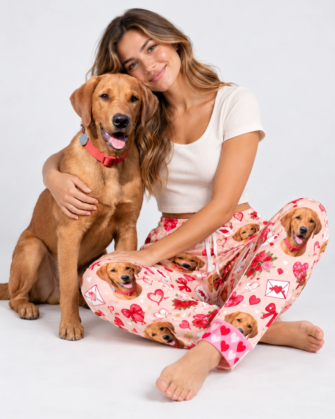 Valentine Pajama Pants – Cuddling Dog | MyDogPics Woman in Valentine pajama pants cuddling her golden retriever — MyDogPics