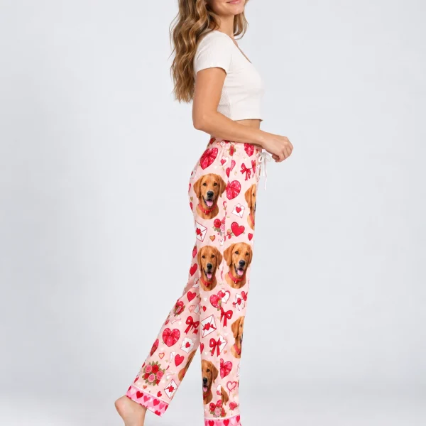 Side view of Valentine pajama pants with golden retriever faces on a pink Valentine hearts print — MyDogPics