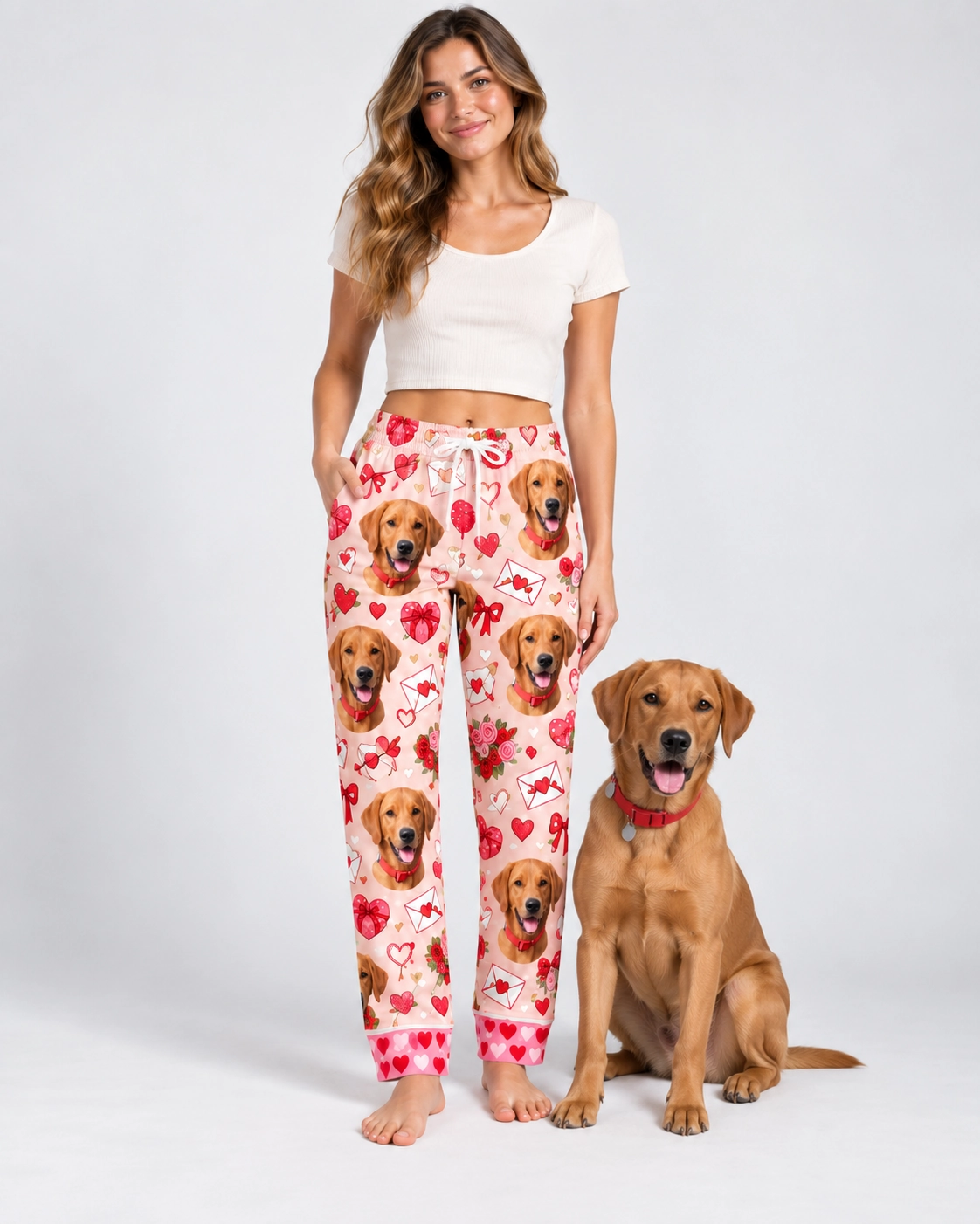 Valentine Pajama Pants – With Dog | MyDogPics Woman in Valentine pajama pants standing next to her golden retriever — MyDogPics