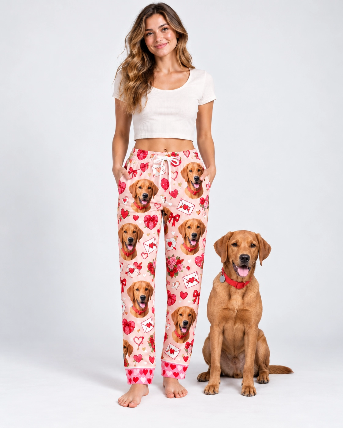 Valentine Pajama Pants – With Dog | MyDogPics Woman in Valentine pajama pants standing next to her golden retriever — MyDogPics