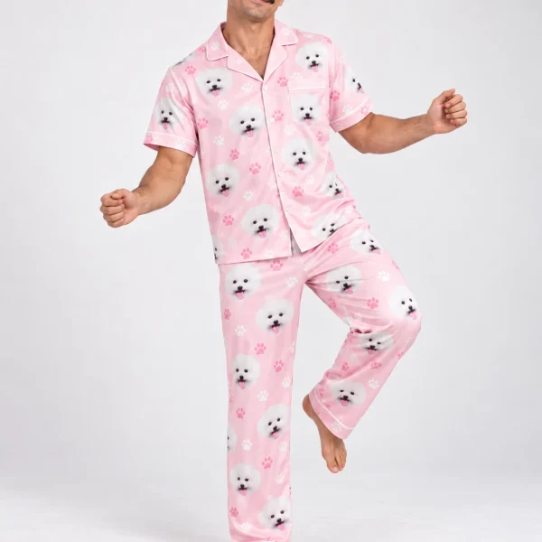 Man posing in Valentines day pajamas, white Pomeranian faces on blush pink paw-print satin — MyDogPics