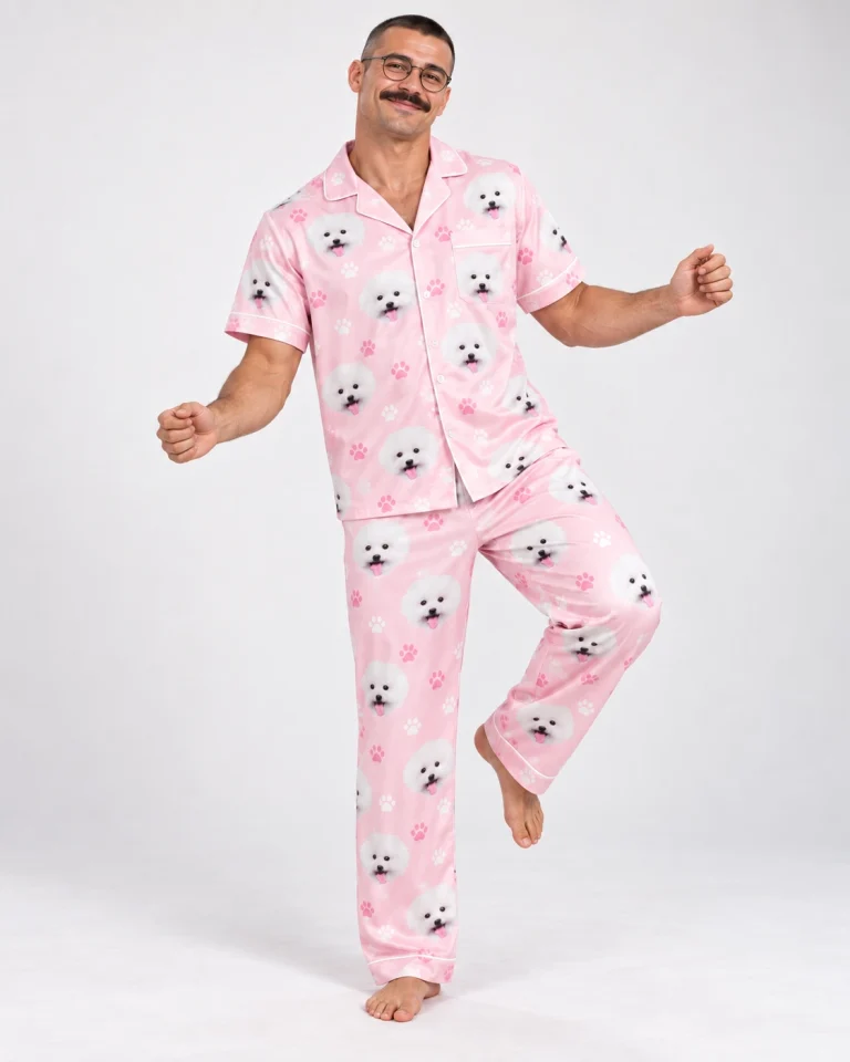 Man posing in Valentines day pajamas, white Pomeranian faces on blush pink paw-print satin — MyDogPics