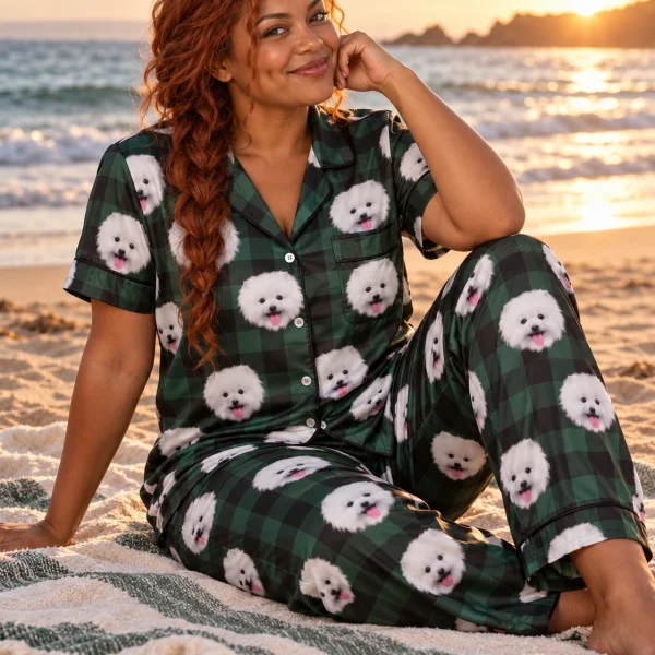Woman sitting in Valentines day pajamas covered in white Pomeranian faces — MyDogPics