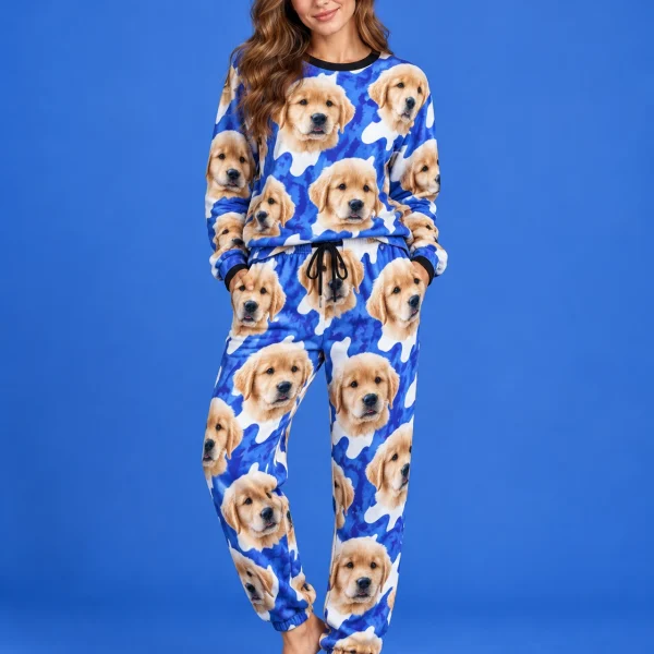 Woman posing in warm pajamas, golden retriever puppy faces on a blue and white spot print — MyDogPics