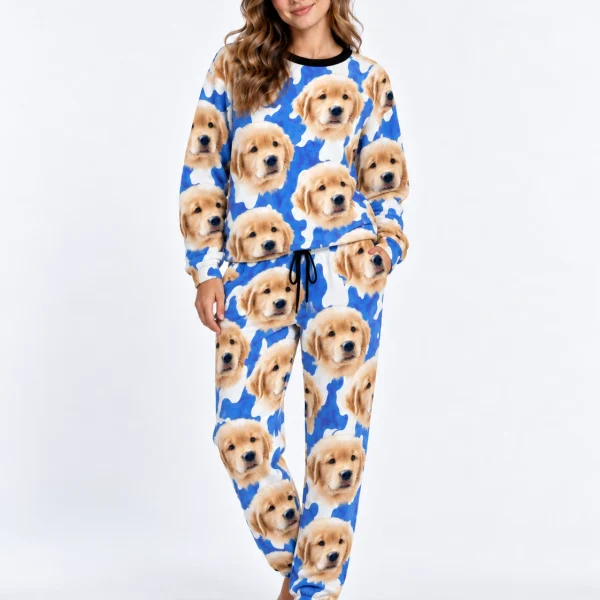 Woman posing in warm pajamas, golden retriever puppy faces on a blue and white spot print — MyDogPics