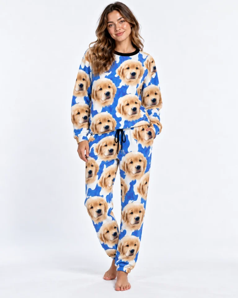 Woman posing in warm pajamas, golden retriever puppy faces on a blue and white spot print — MyDogPics