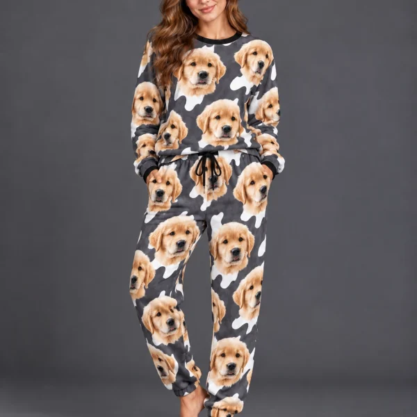 Woman posing in warm pajamas, golden retriever puppy faces on a charcoal and white spot print — MyDogPics