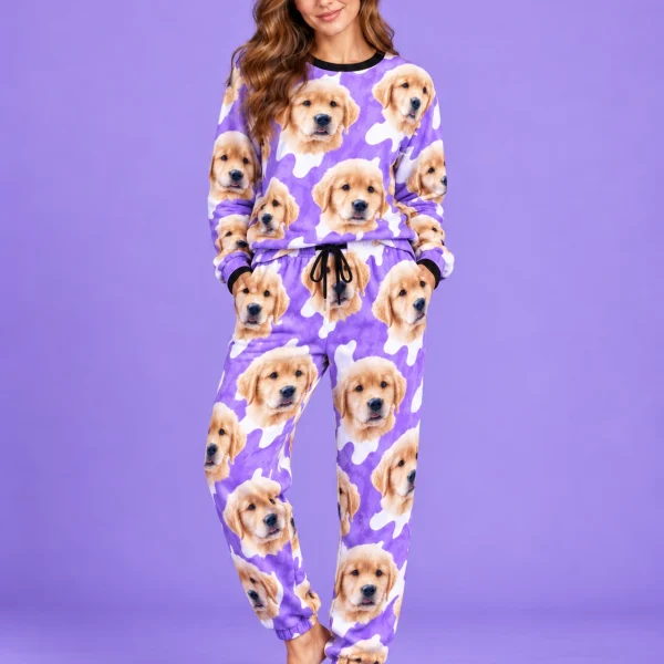 Woman posing in warm pajamas, golden retriever puppy faces on a purple and white spot print — MyDogPics