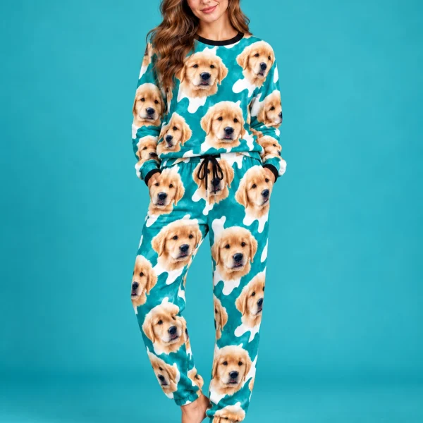 Woman posing in warm pajamas, golden retriever puppy faces on a teal and white spot print — MyDogPics
