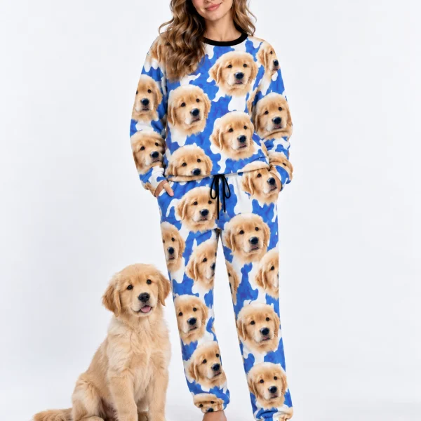 Woman in warm pajamas standing next to her golden retriever puppy — MyDogPics