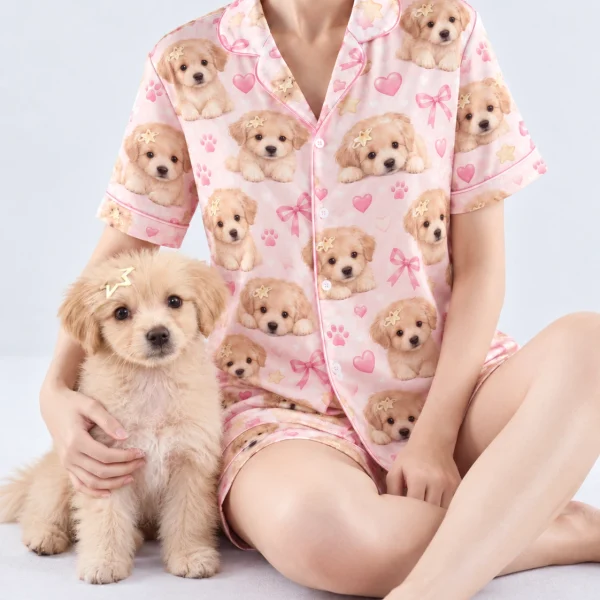 Woman in womens dog pajamas cuddling her fluffy puppy — MyDogPics