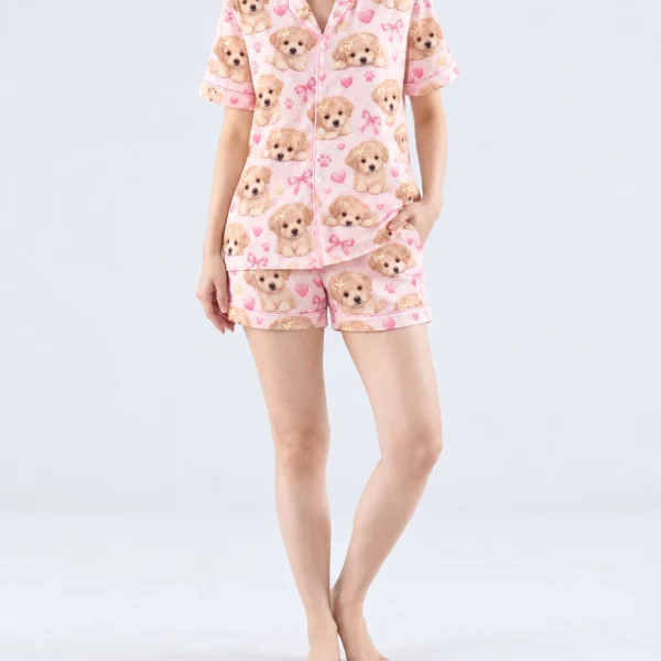 Woman wearing womens dog pajamas covered in fluffy cream puppy faces on blush pink satin with bows — MyDogPics