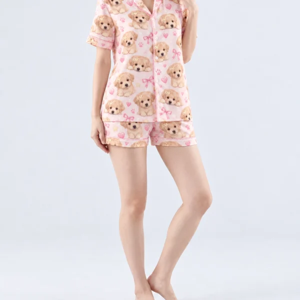 Woman wearing womens dog pajamas covered in fluffy cream puppy faces on blush pink satin with bows — MyDogPics