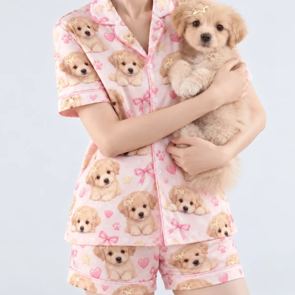 Woman in womens dog pajamas holding her fluffy puppy — MyDogPics